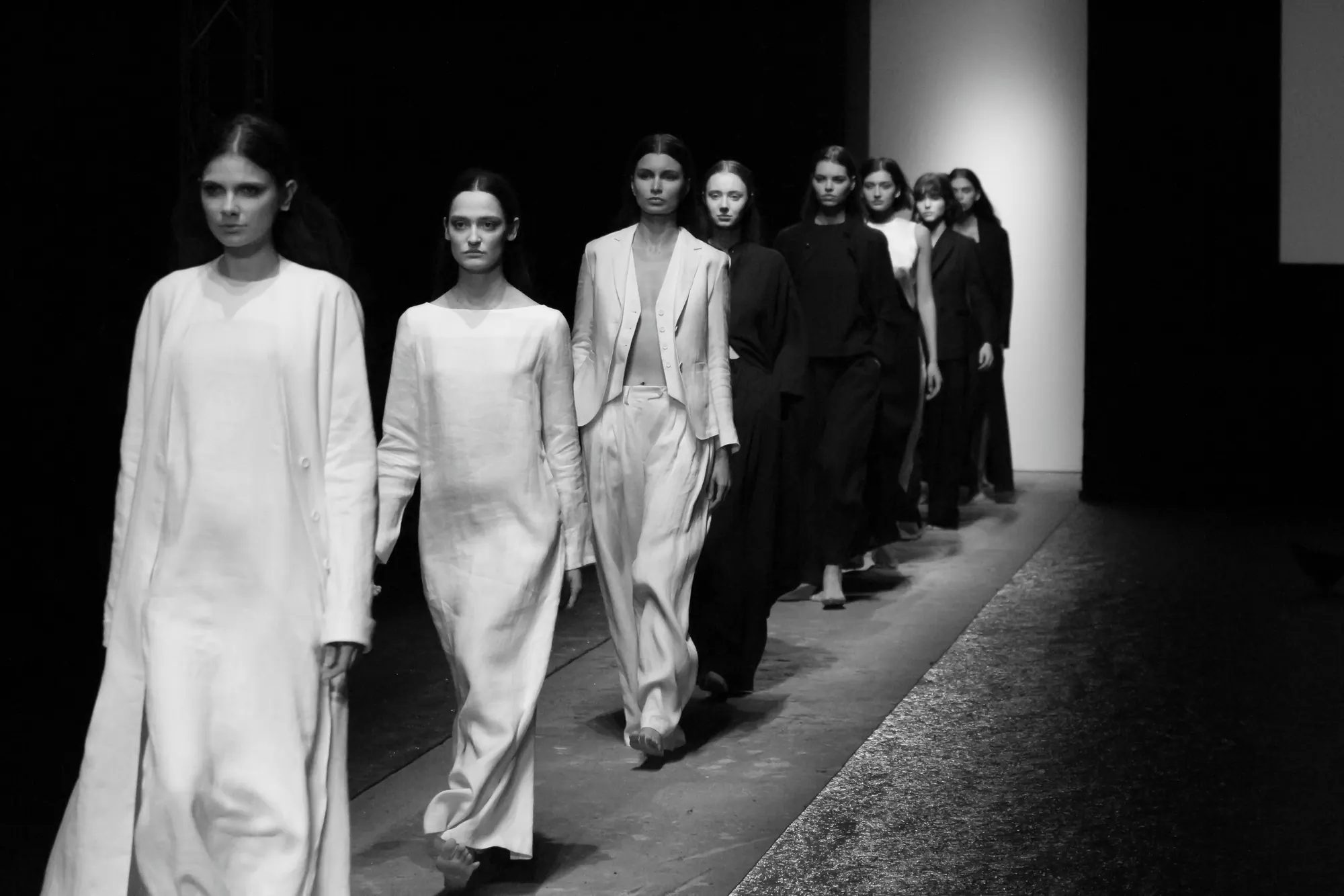 The full line of models walking the finale in white and black